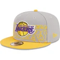 gra-og-gul-snapback-fladskaerm-9fifty-draft-edition-2023-los-angeles-lakers-nba-kasket-fra-new-era