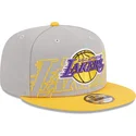gra-og-gul-snapback-fladskaerm-9fifty-draft-edition-2023-los-angeles-lakers-nba-kasket-fra-new-era