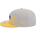 gra-og-gul-snapback-fladskaerm-9fifty-draft-edition-2023-los-angeles-lakers-nba-kasket-fra-new-era
