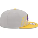 gra-og-gul-snapback-fladskaerm-9fifty-draft-edition-2023-los-angeles-lakers-nba-kasket-fra-new-era