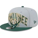 gra-og-gron-fladskygget-snapback-9fifty-tip-off-2023-milwaukee-bucks-nba-kasket-fra-new-era