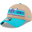charlotte-hornets-nba-new-era-9twenty-draft-2024-justerbar-brun-og-bla-bojet-skygge-kasket
