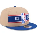 brun-og-bla-snapback-fladskygget-kasket-9fifty-draft-2024-nba-fra-new-era