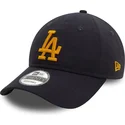 justerbar-marinebla-kurvet-kasket-med-gult-logo-9twenty-league-essential-fra-los-angeles-dodgers-mlb-fra-new-era