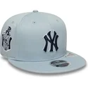 bla-snapback-fladskygget-kasket-med-marineblat-logo-9fifty-original-fit-world-series-fra-new-york-yankees-mlb-af-new-era