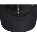 marinebla-og-brun-9seventy-stretch-snap-trucker-cap-med-praeget-logo-fra-new-york-yankees-mlb-fra-new-era